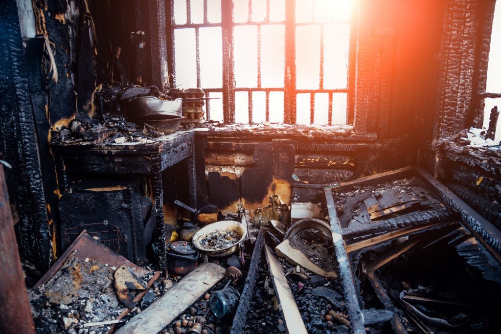 A kitchen with severe fire damage in Peoria IL