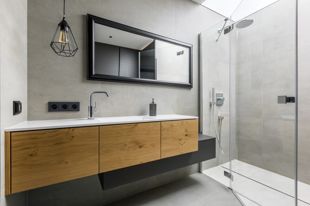 A beautiful recently remodeled modern, gray bathroom.