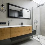 A beautiful recently remodeled modern, gray bathroom.