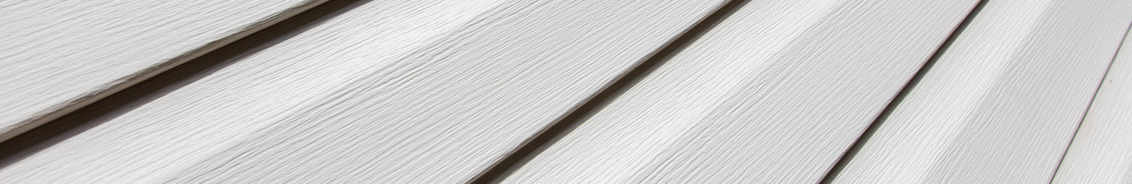Wood siding restored and repainted after rot repair